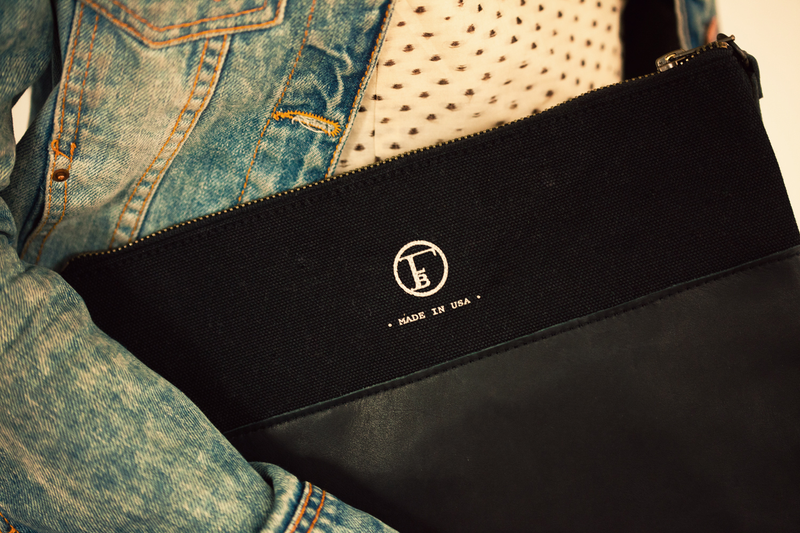 Illustration for article titled A Sturdy Black Clutch That Holds Almost Anything